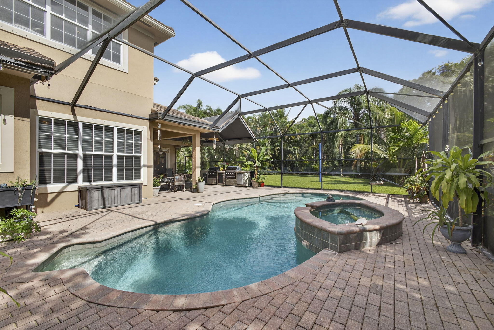129 Via Bosque Jupiter, FL 33458 - Photo 69 of 92 a view of a swimming pool with a patio