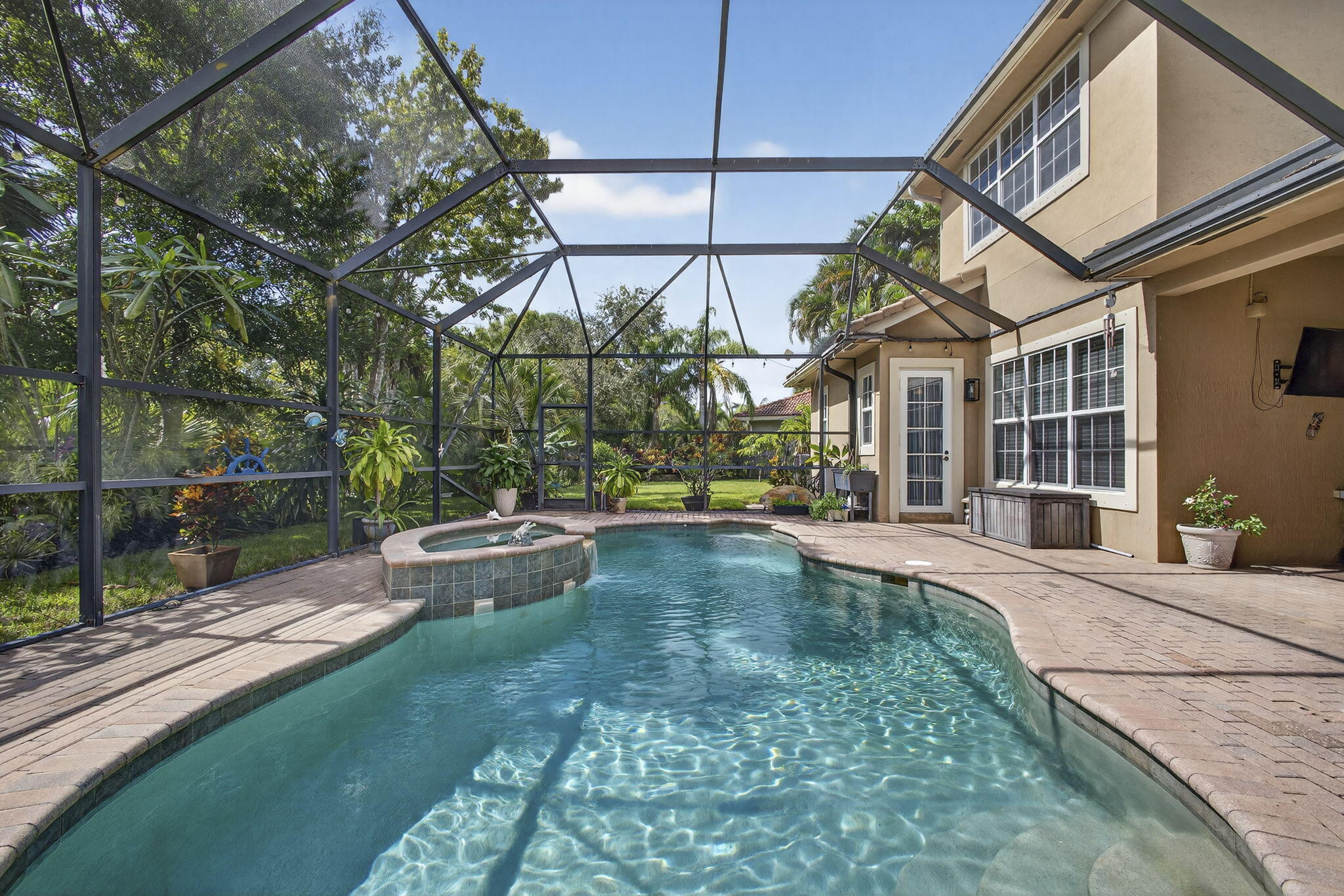 129 Via Bosque Jupiter, FL 33458 - Photo 71 of 92 a view of a house with backyard and sitting area