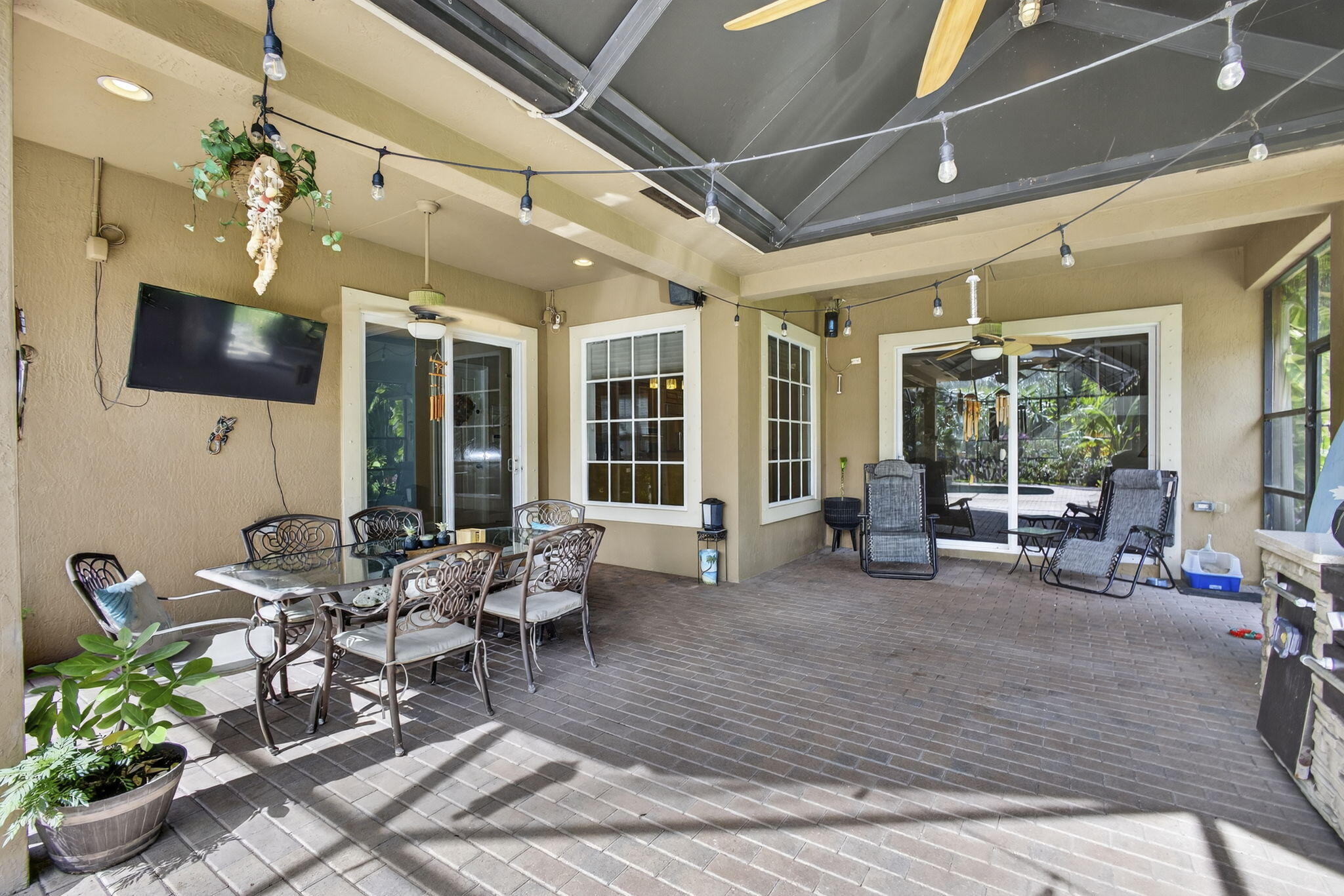 129 Via Bosque Jupiter, FL 33458 - Photo 76 of 92 a living room with furniture and a flat screen tv