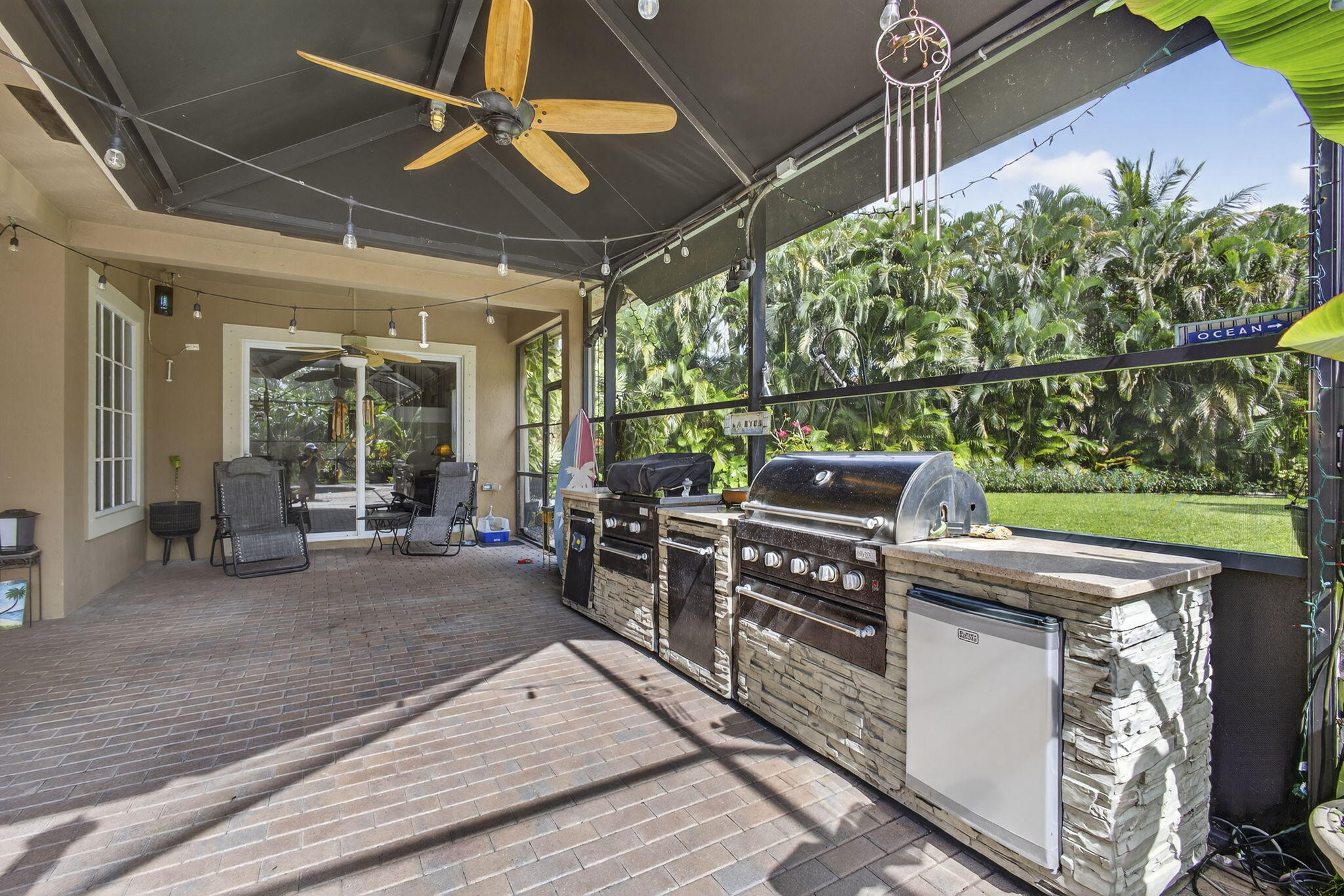 129 Via Bosque Jupiter, FL 33458 - Photo 77 of 92 a view of a chairs and table in a patio