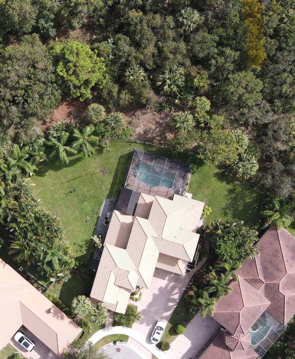 129 Via Bosque Jupiter, FL 33458 - Photo 92 of 92 an aerial view of a house with a yard