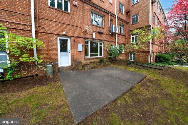 a view of a building with a yard