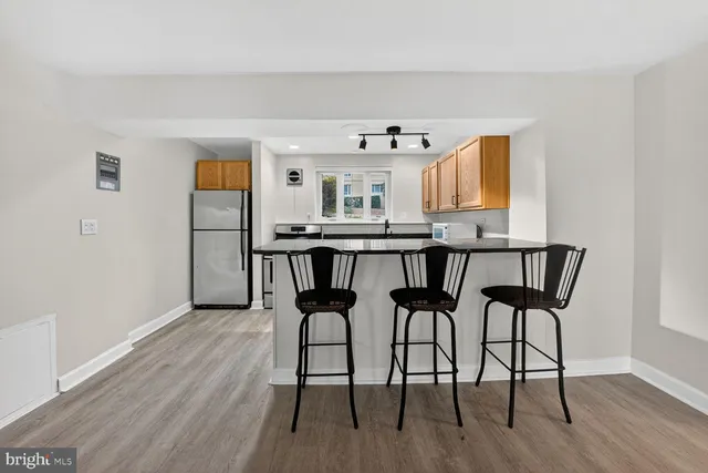 a view of a dining room with furniture and wooden floor