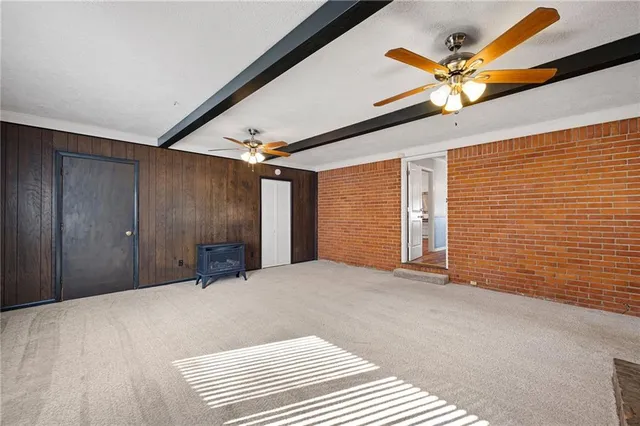 a view of a livingroom with a hall and a window