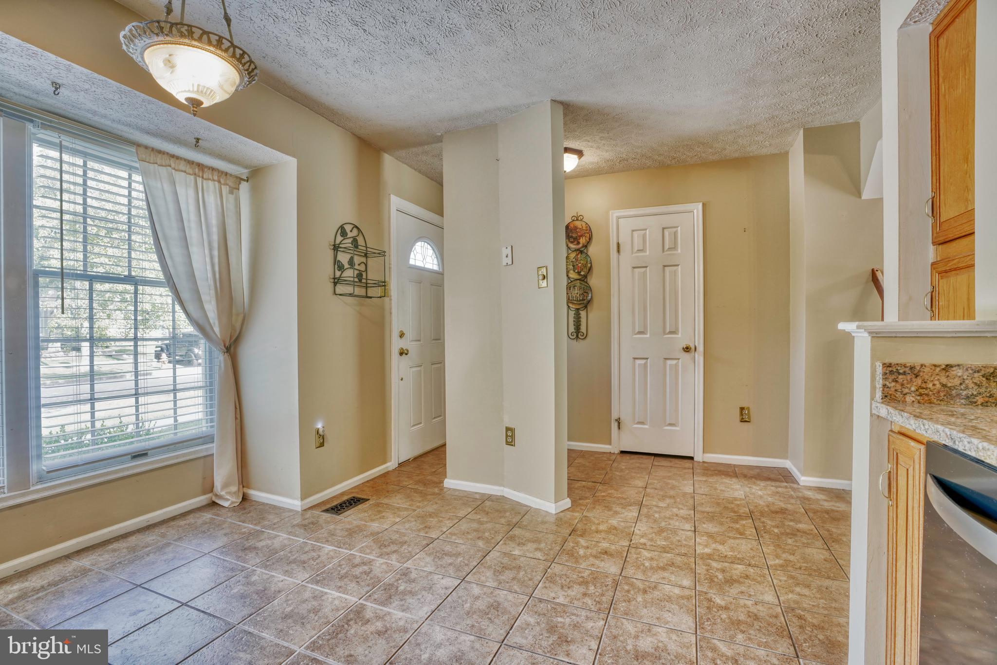 8738 Silver Hall Road Perry Hall, MD 21128 - Photo 6 of 34 Foyer and Kitchen