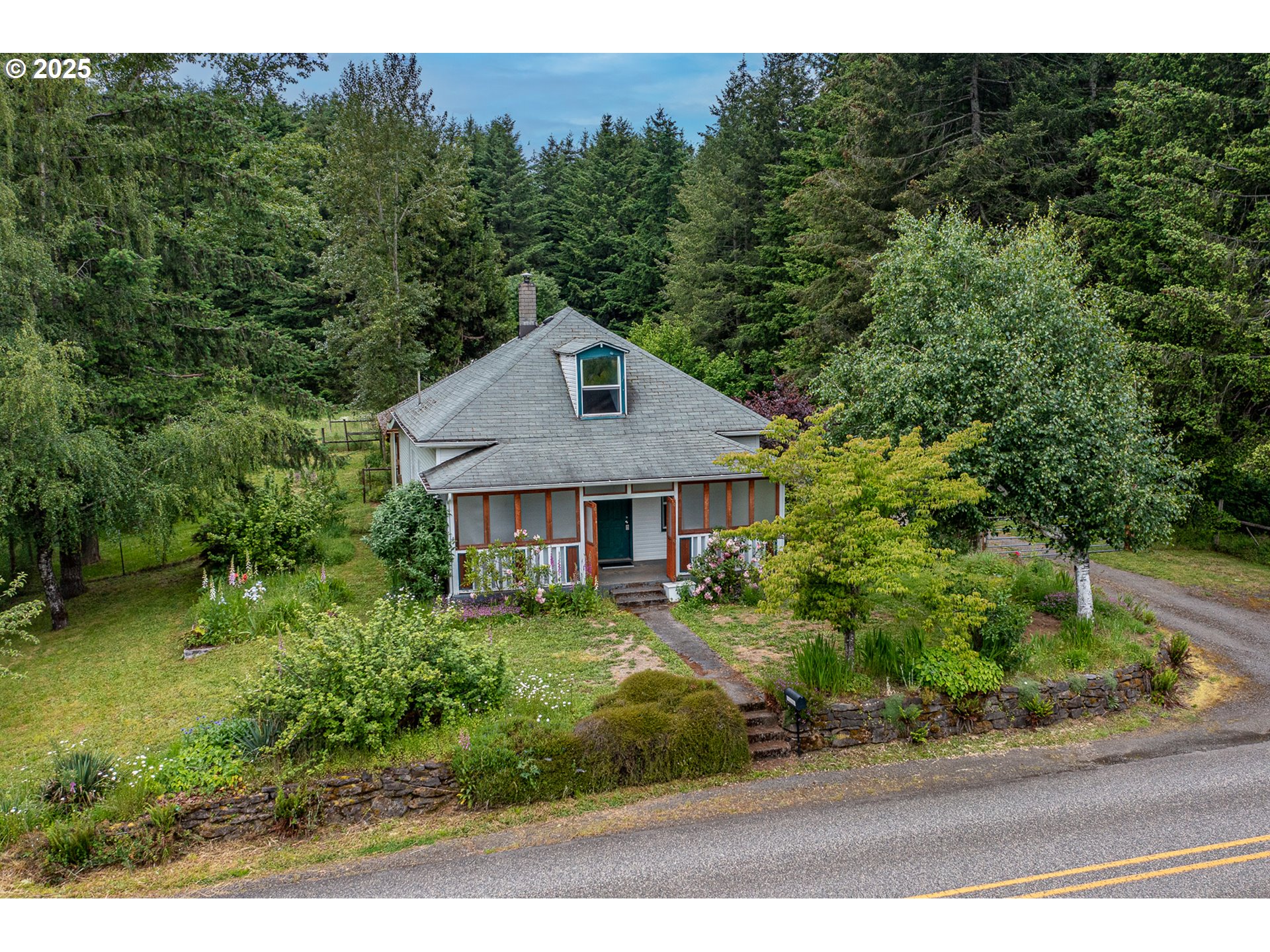 10303 Southeast Bull Run Road Sandy, OR 97055 - Photo 1 of 48 a front view of a house with a yard