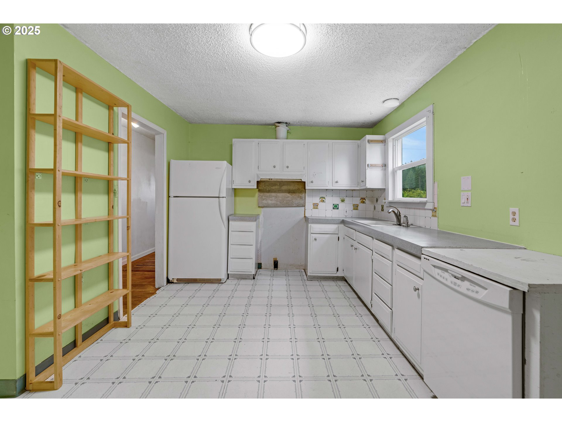 10303 Southeast Bull Run Road Sandy, OR 97055 - Photo 12 of 48 a kitchen with a sink cabinets and window
