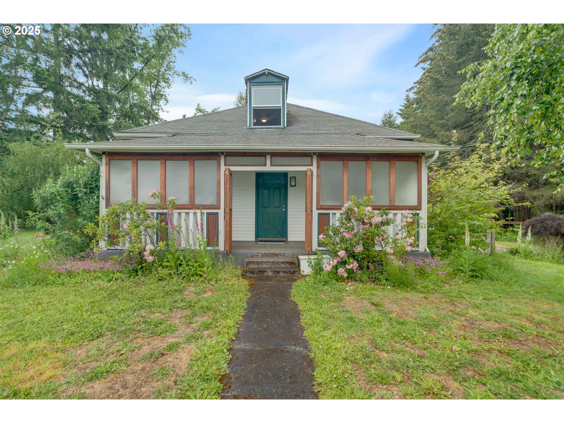 10303 Southeast Bull Run Road Sandy, OR 97055 - Photo 4 of 48 a front view of a house with a yard