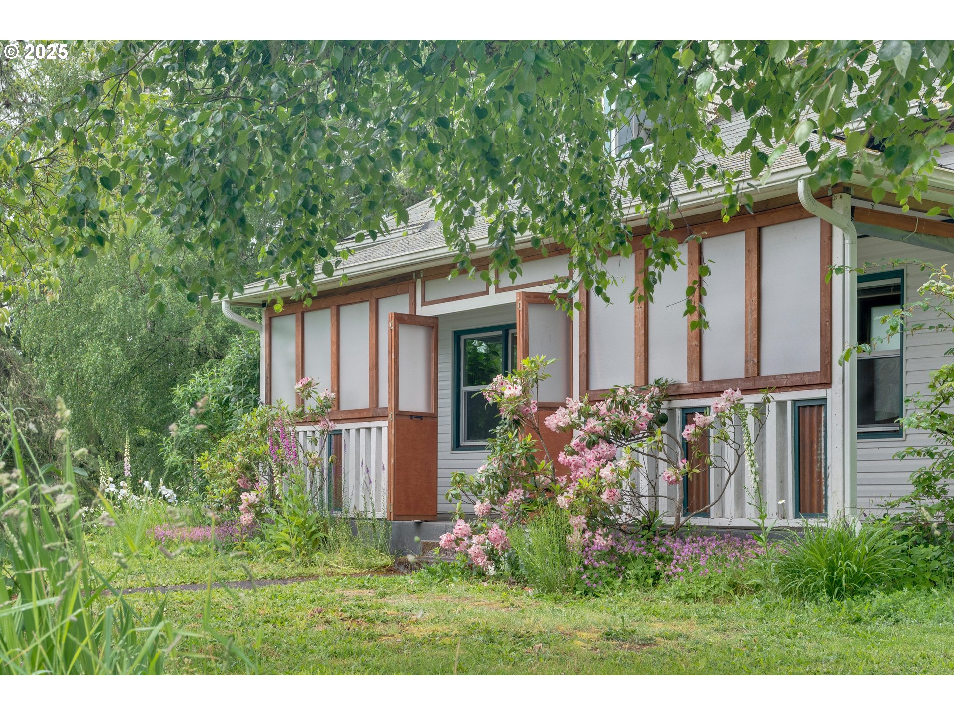 10303 Southeast Bull Run Road Sandy, OR 97055 - Photo 5 of 48 a view of a house with backyard and garden