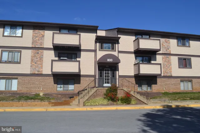 a view of a house with swimming pool and a yard