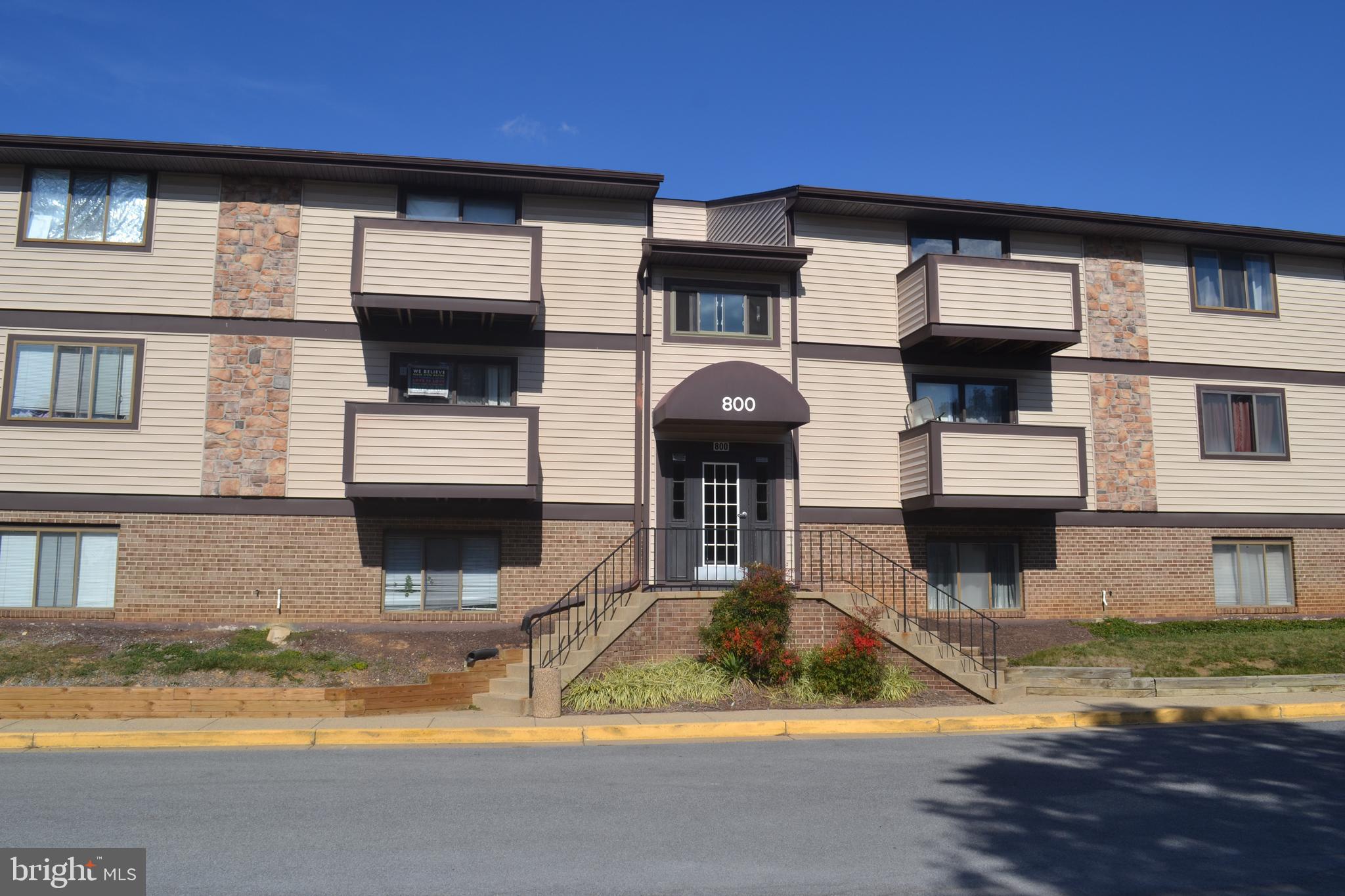 800 L Heather Ridge Drive, Unit 19L Frederick, MD 21702 - Photo 1 of 10 a view of a house with swimming pool and a yard