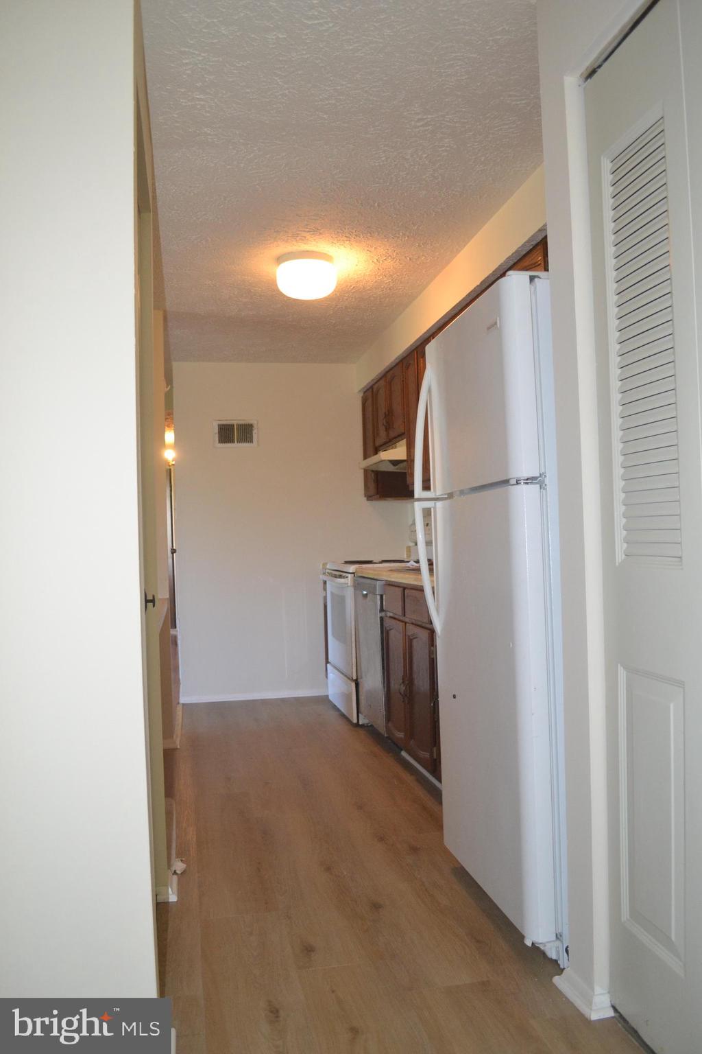 800 L Heather Ridge Drive, Unit 19L Frederick, MD 21702 - Photo 5 of 10 a view of a storage & utility room with washer and dryer