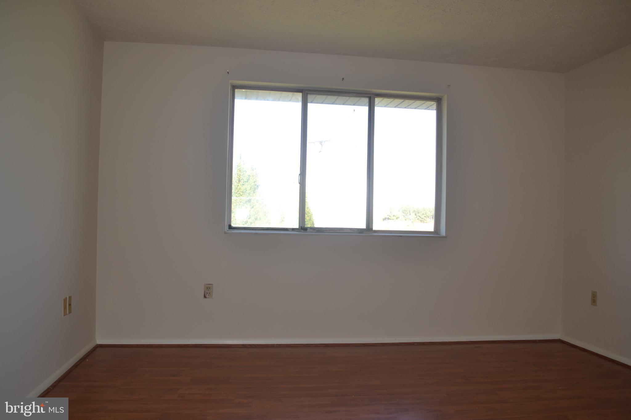 800 L Heather Ridge Drive, Unit 19L Frederick, MD 21702 - Photo 7 of 10 an empty room with a window