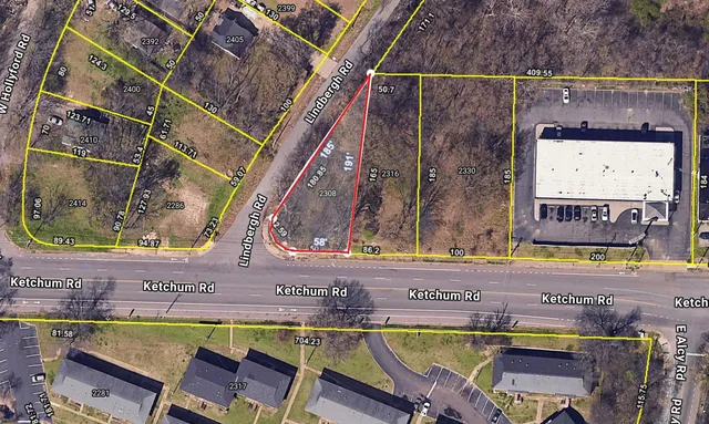 a view of an outdoor sitting area with a table and chair