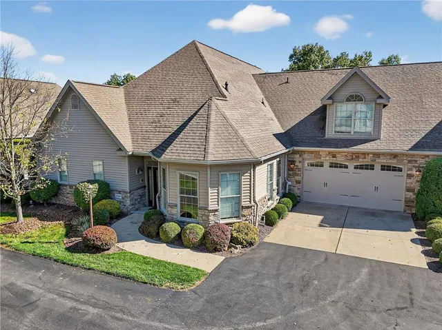 front view of a house with a patio