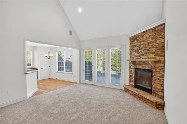 an empty room with furniture and a fireplace