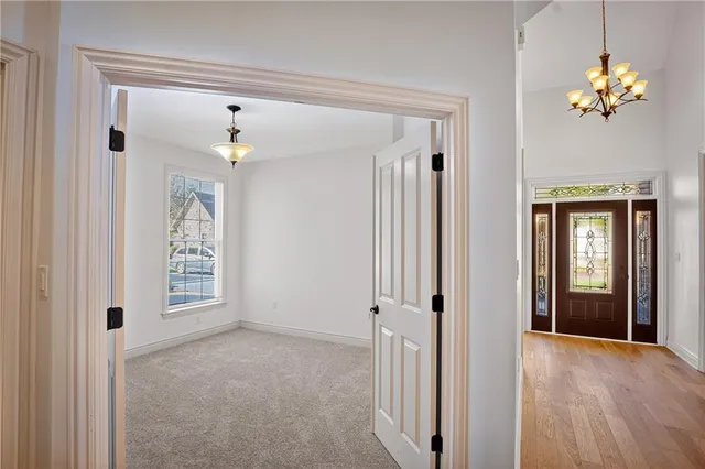 a view of a hallway with a chandelier