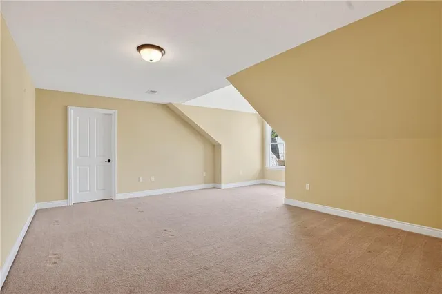 a view of an empty room with windows