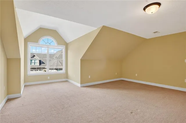 an empty room with a fireplace