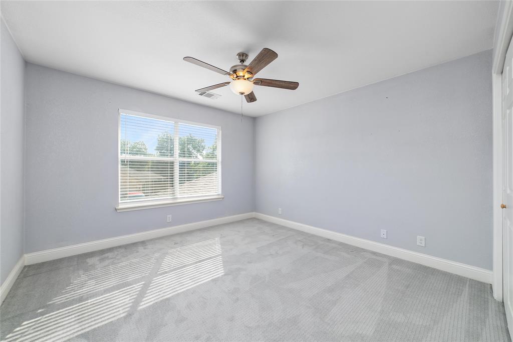 3002 Waterstone Way Brownwood, TX 76801 - Photo 14 of 35 an empty room with windows and fan
