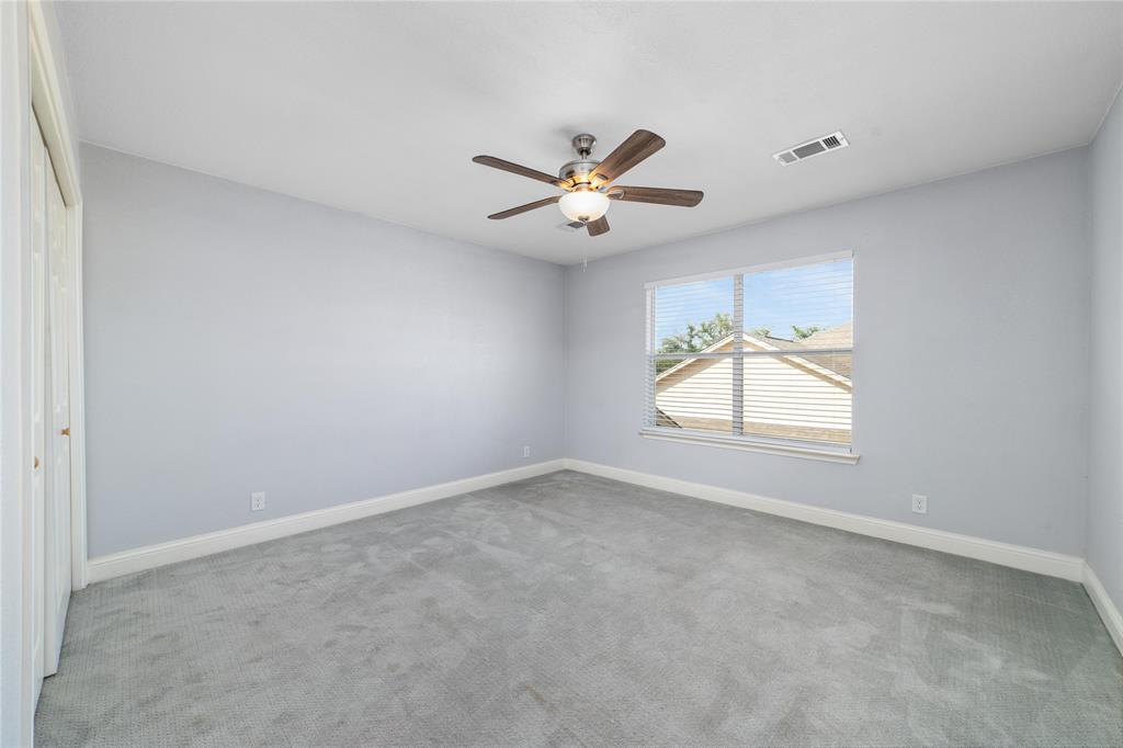 3002 Waterstone Way Brownwood, TX 76801 - Photo 15 of 35 an empty room with windows and chandelier fan