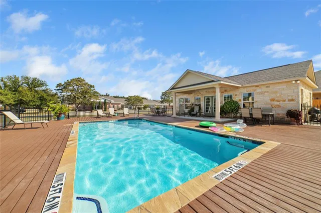 a view of swimming pool with a yard