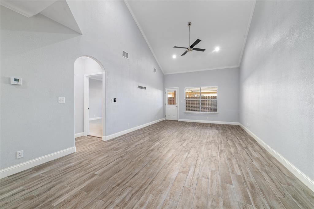 3002 Waterstone Way Brownwood, TX 76801 - Photo 5 of 35 wooden floor in an empty room with a window