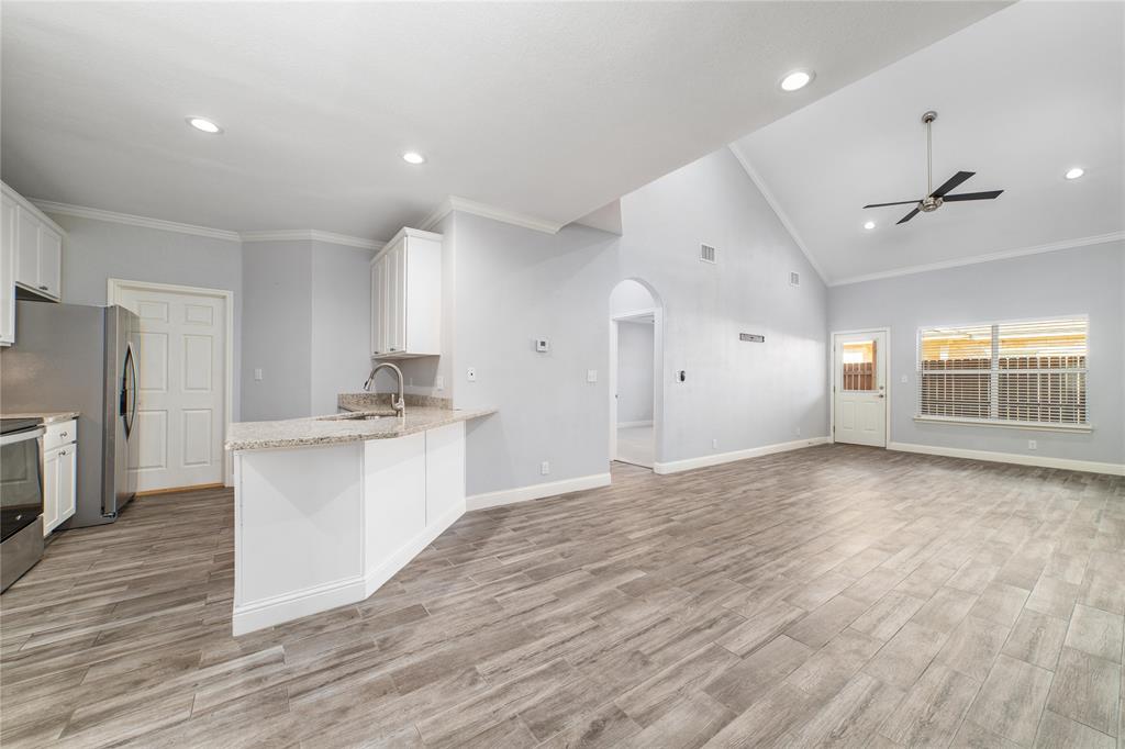 3002 Waterstone Way Brownwood, TX 76801 - Photo 9 of 35 a view of a kitchen with a sink and a refrigerator