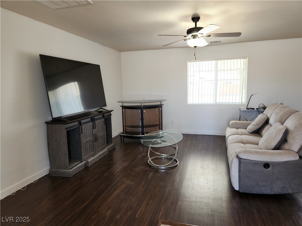 161 Diamond Bar Road Pahrump, NV 89048 - Photo 4 of 29 Living area featuring wood finished floors and ceiling fan