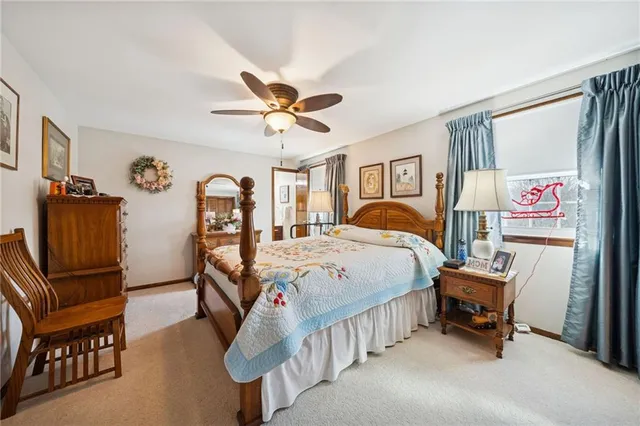 a bedroom with furniture and a chandelier