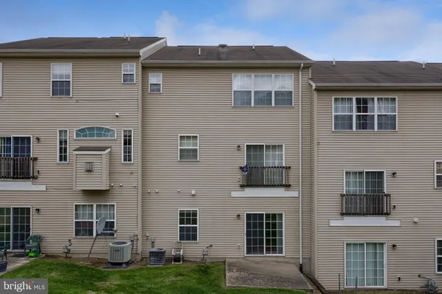 a view of a building with a yard
