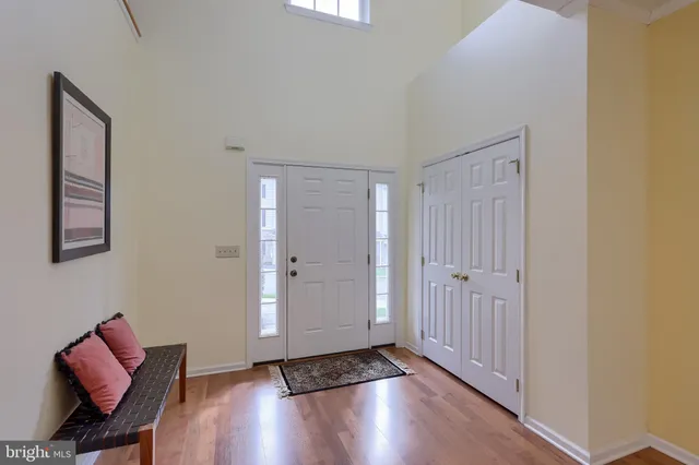 a view of an entryway with wooden floor