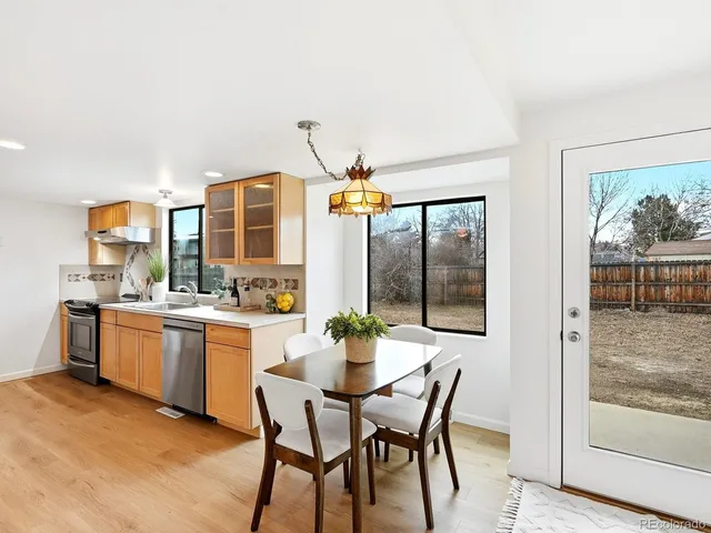 a dining room with furniture and window