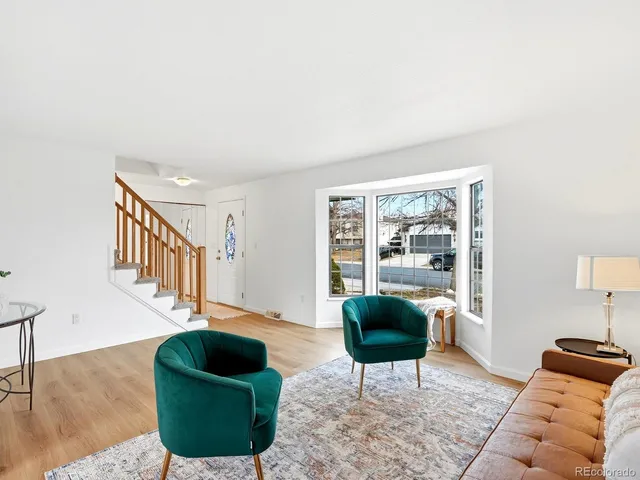 a living room with furniture and a rug