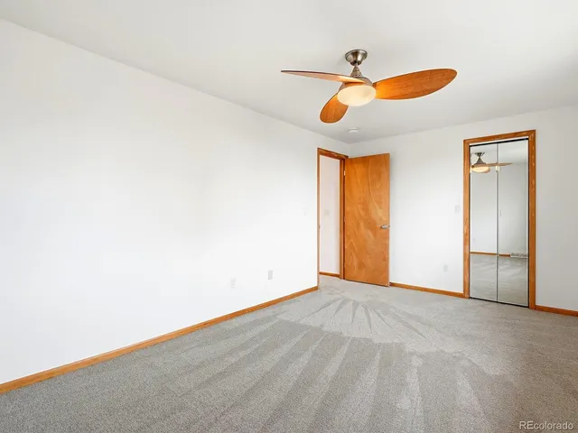 a view of an empty room with windows