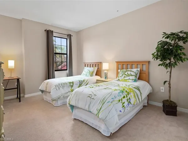 a bedroom with a bed and a table