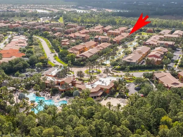 an aerial view of residential house with outdoor space and swimming pool