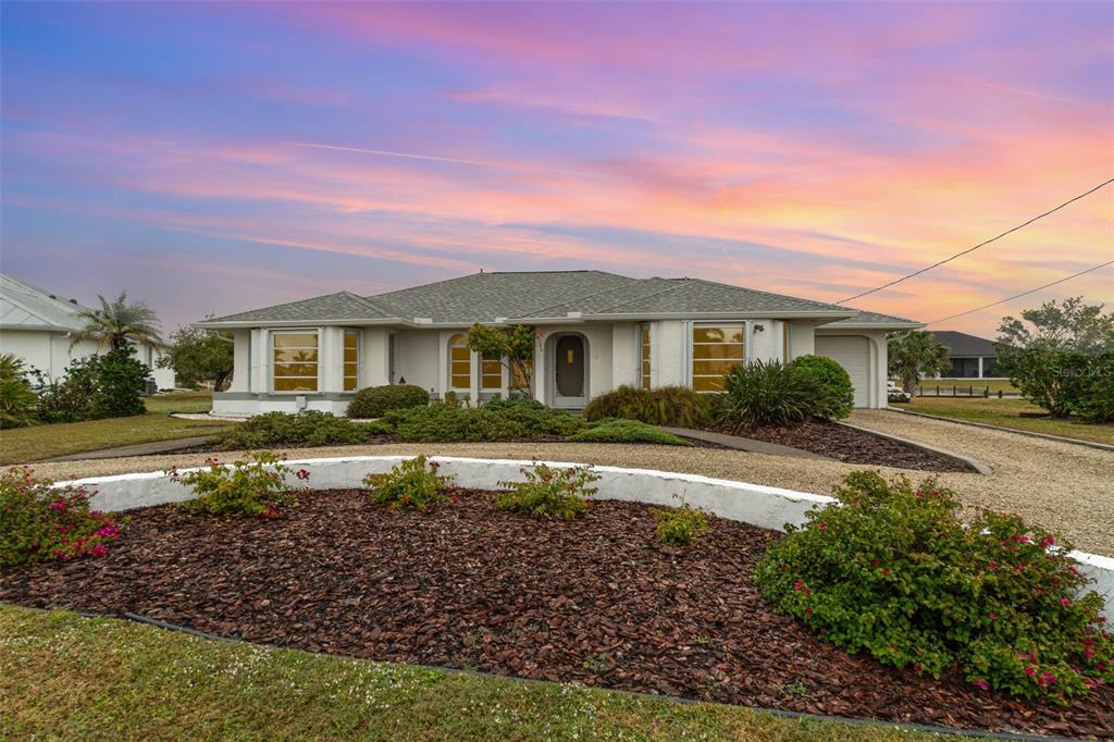 4106 Library Street Port Charlotte, FL 33948 - Photo 1 of 1 a front view of a house with a yard