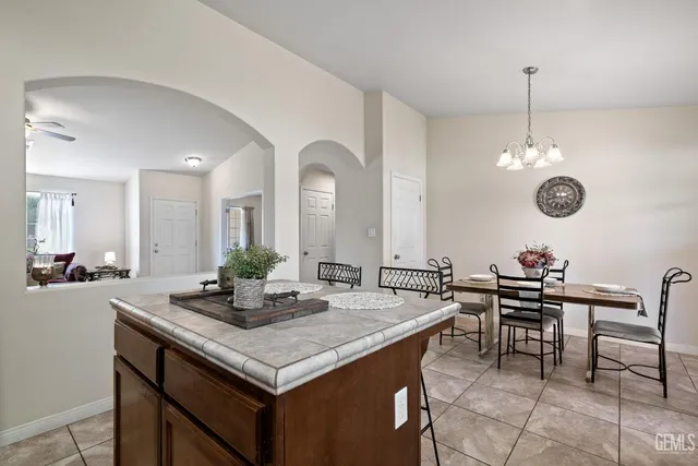 a kitchen with a table and chairs in it