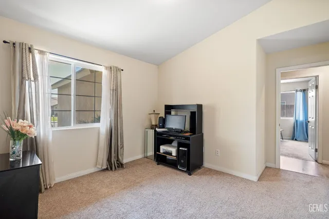 an empty room with furniture and windows