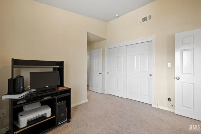 a living room with a flat screen tv and a window