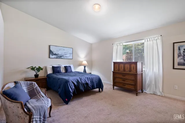 a bedroom with furniture and a window