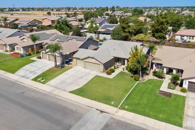 an aerial view of a house with a garden