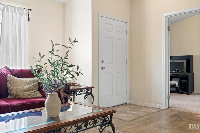 a view of a dining room with furniture and table