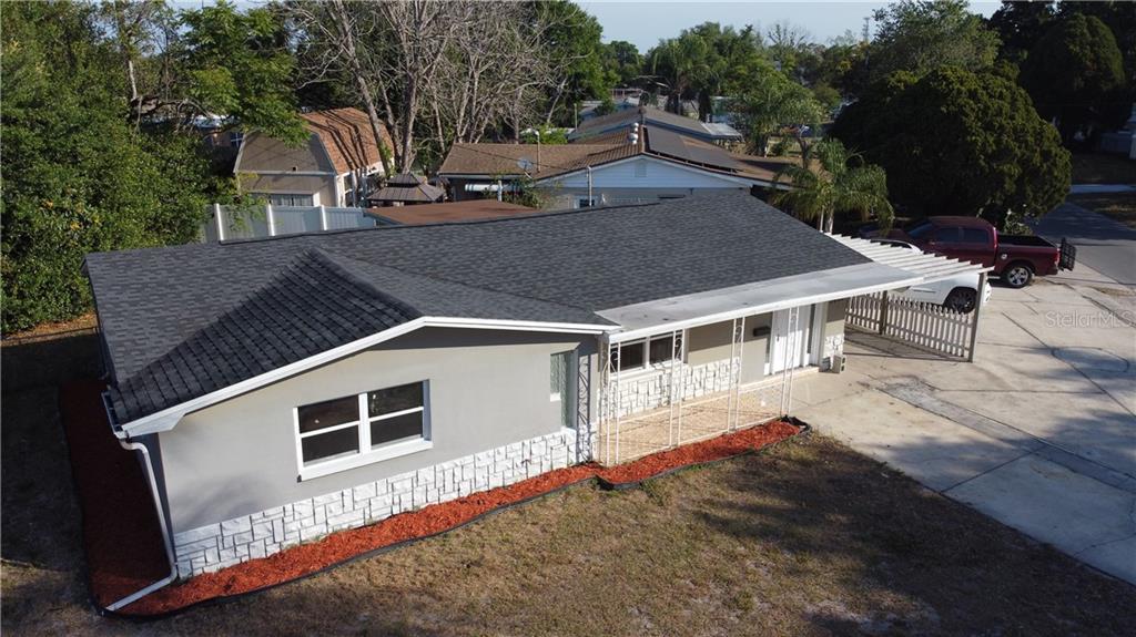 5405 Trouble Creek Road New Port Richey, FL 34652 - Photo 1 of 1 a aerial view of a house with a yard