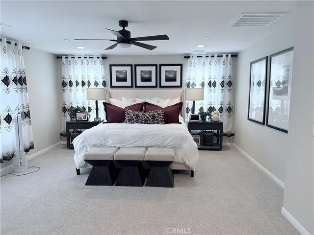 a bed room with a bed and a couch