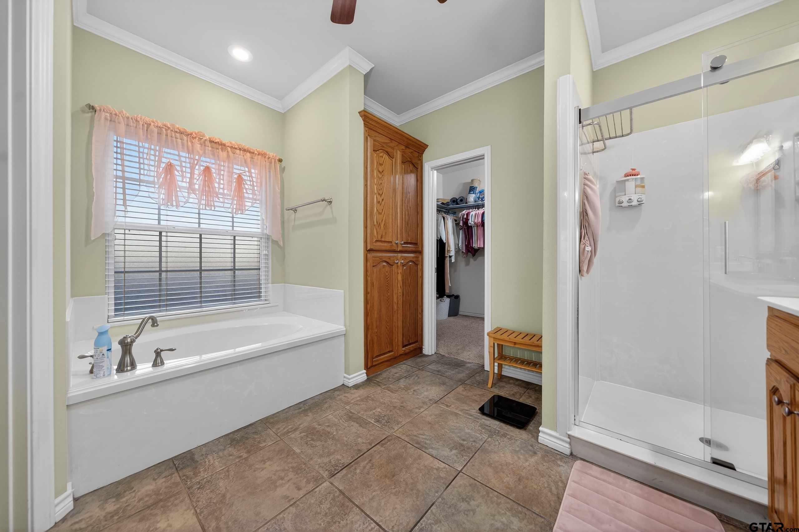 332 Highlander Heights Hideaway, TX 75771 - Photo 24 of 39 a bathroom with a tub shower and a sink