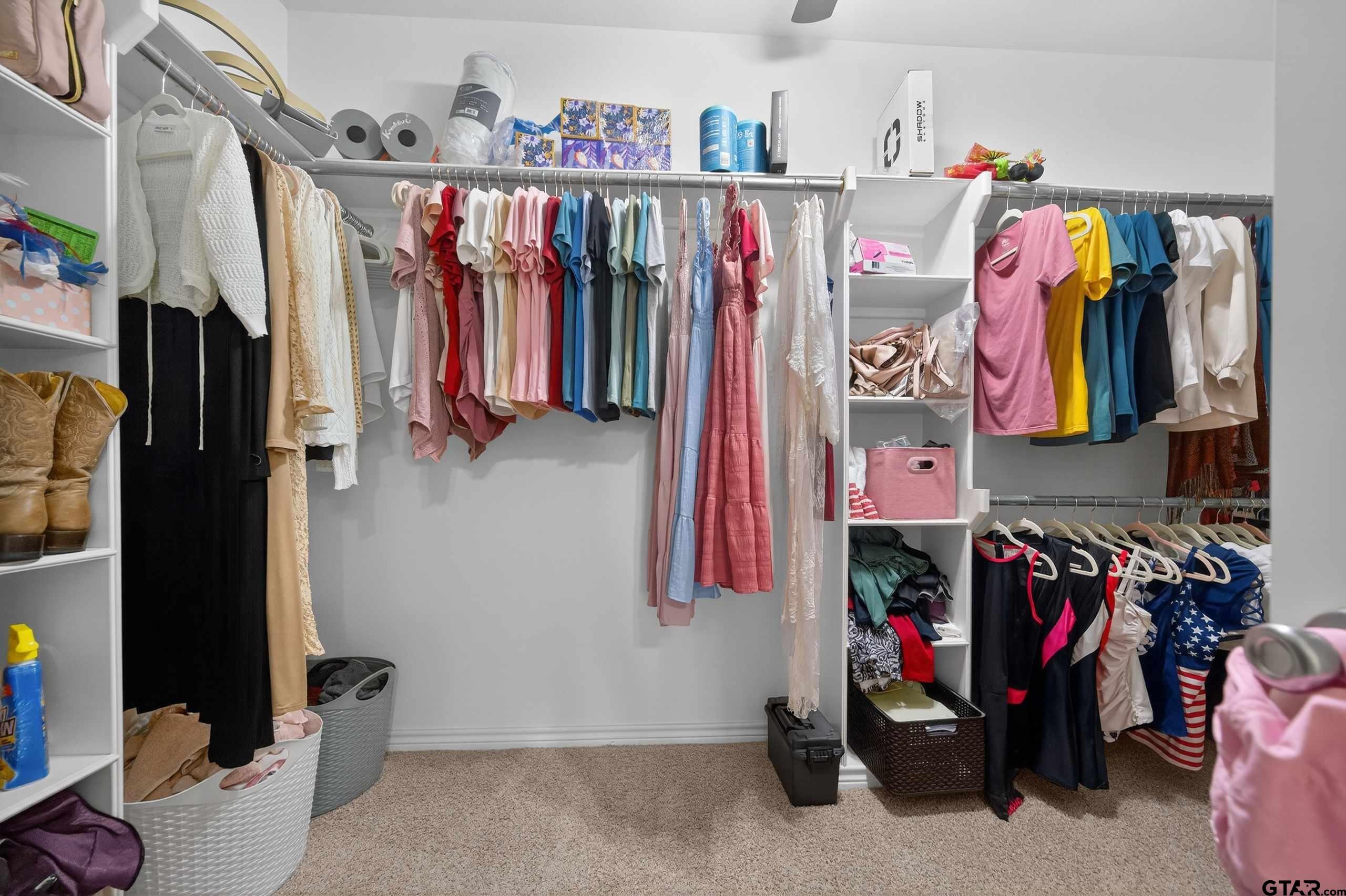 332 Highlander Heights Hideaway, TX 75771 - Photo 25 of 39 a view of walk in closet with clothes and shoes