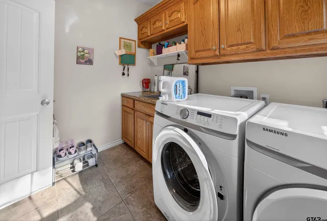 a utility room with dryer and washer