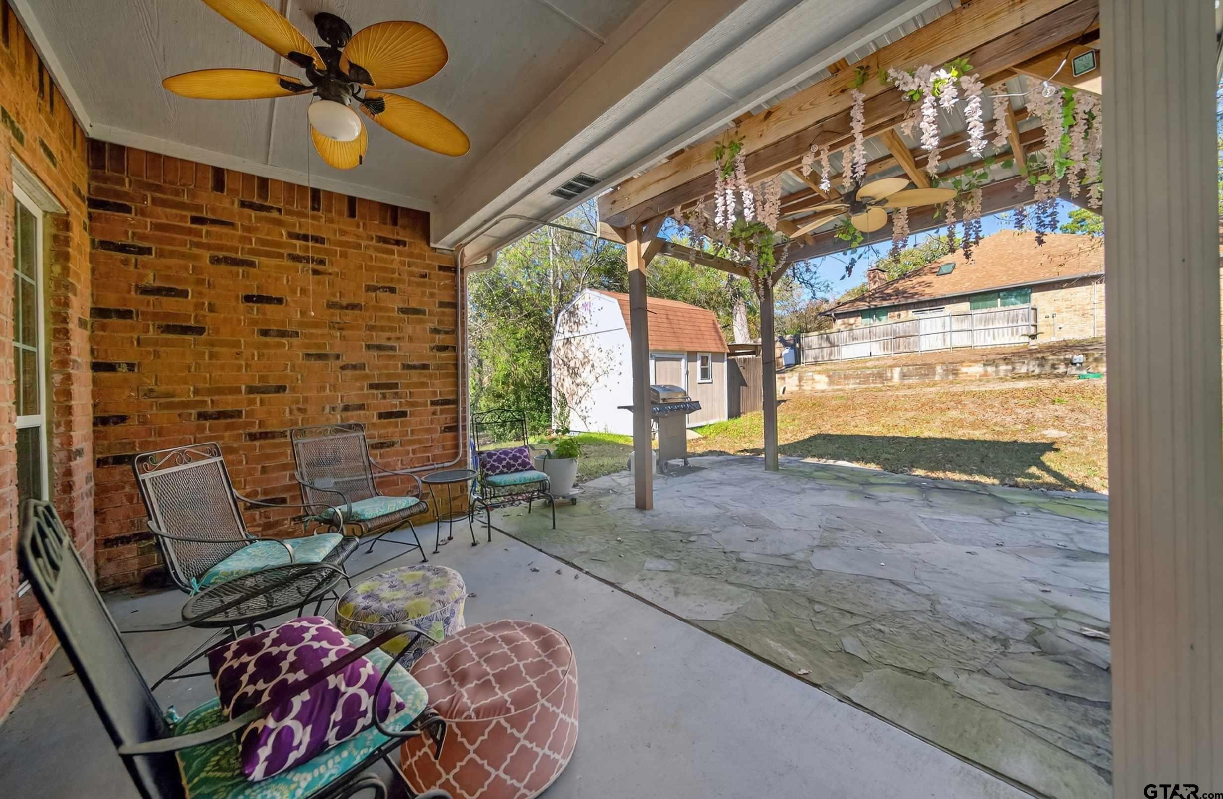 332 Highlander Heights Hideaway, TX 75771 - Photo 35 of 39 a living room with furniture and a floor to ceiling window
